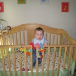 See!  I can stand in my crib.